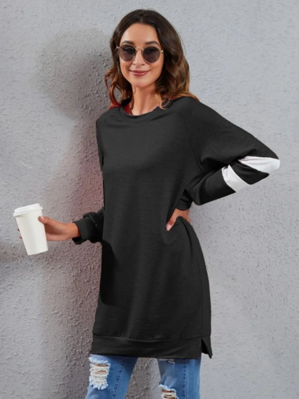 Black long-sleeve T-shirt with round neck and white striped sleeve cuffs