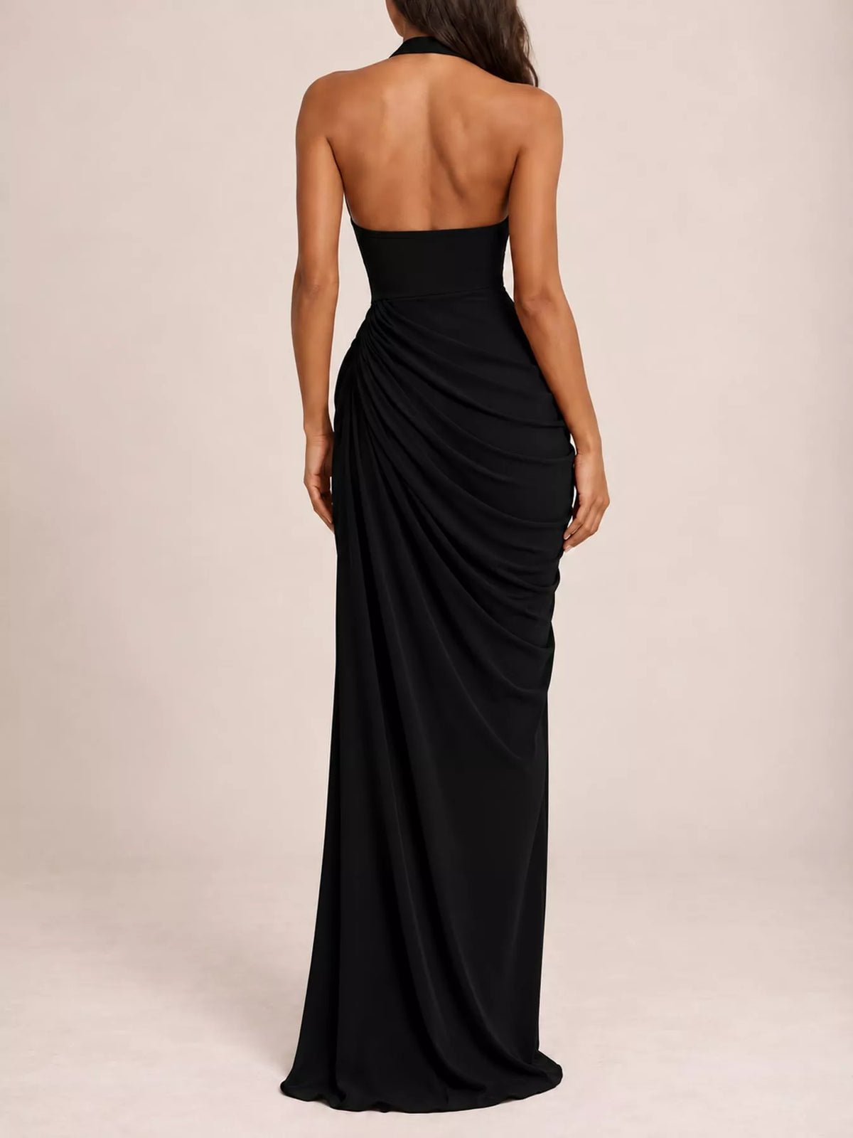 Back view of black halter neck maxi dress with ruched drape and high slit