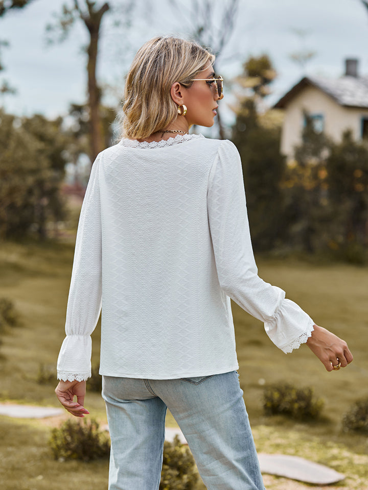 Flounce-sleeve blouse in white, V-neck style with cuffed sleeves, back view