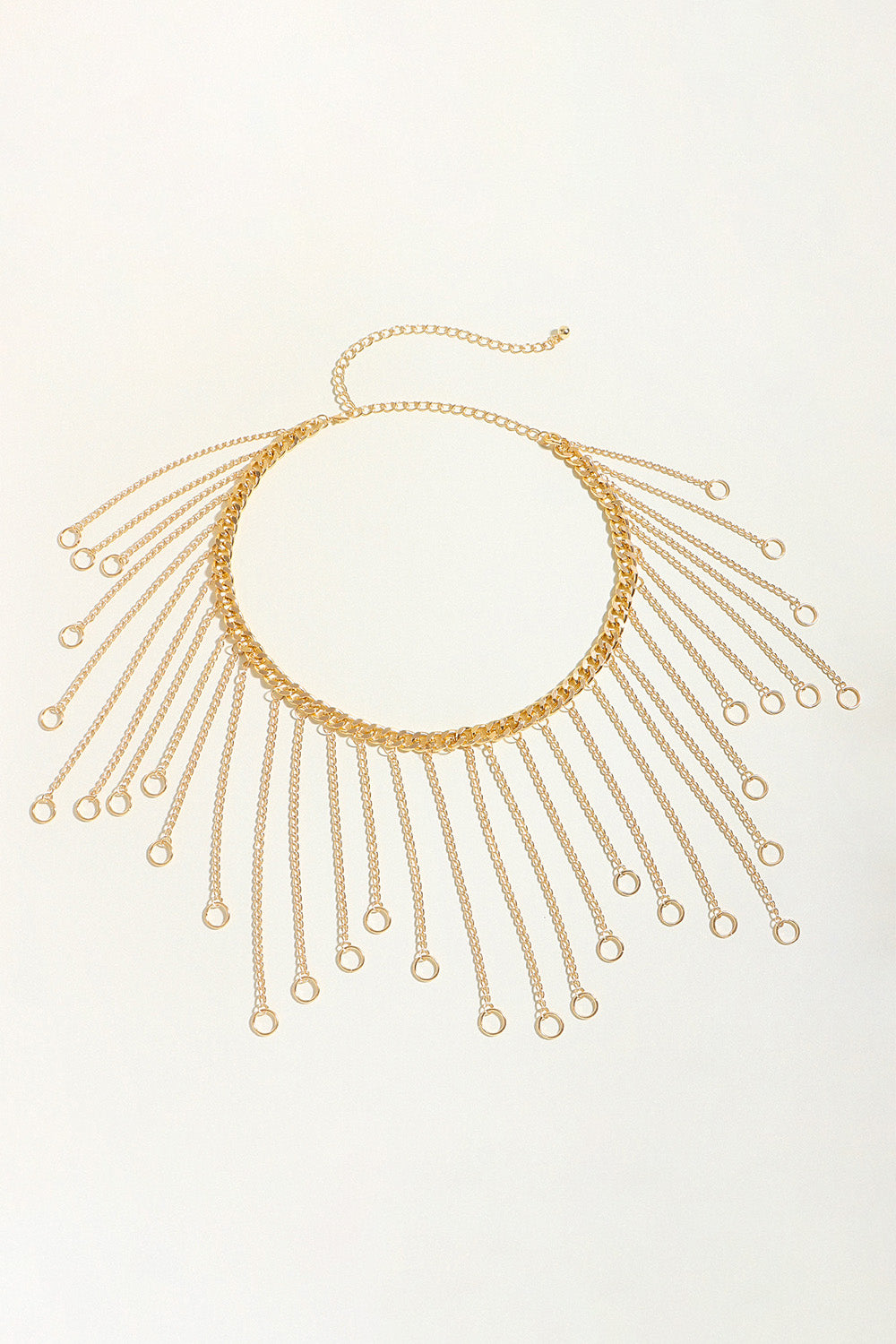 Gold chain fringe belt with circular ring center and multiple dangling oval drops