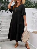 Black tiered midi dress with ruffle sleeves, flowing tiered skirt and V-neck