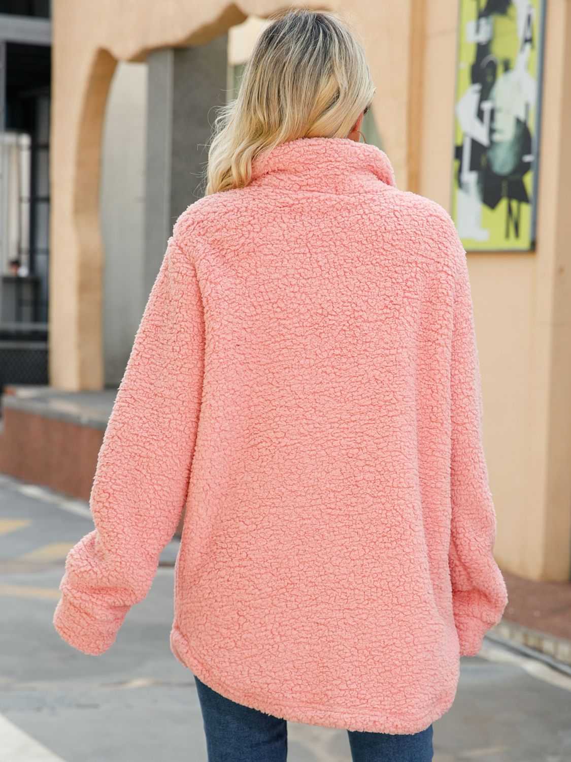 Blush pink textured fleece collared coat, back view with long sleeves