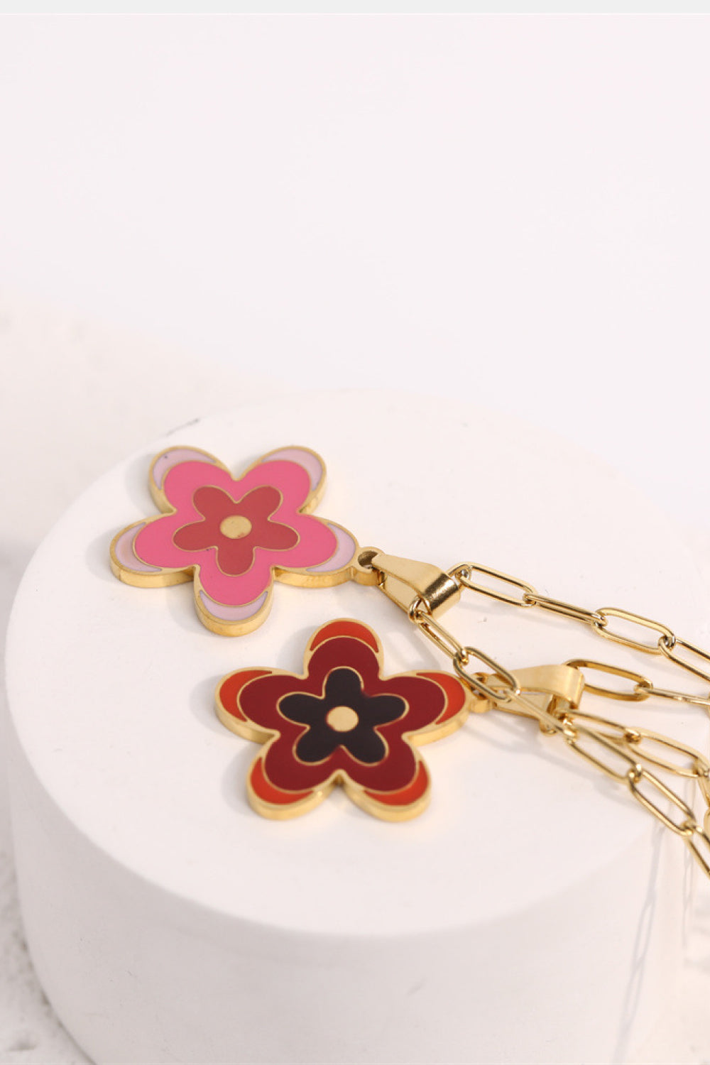 Flower pendant necklace with gold chain and pink/red enamel flower charms