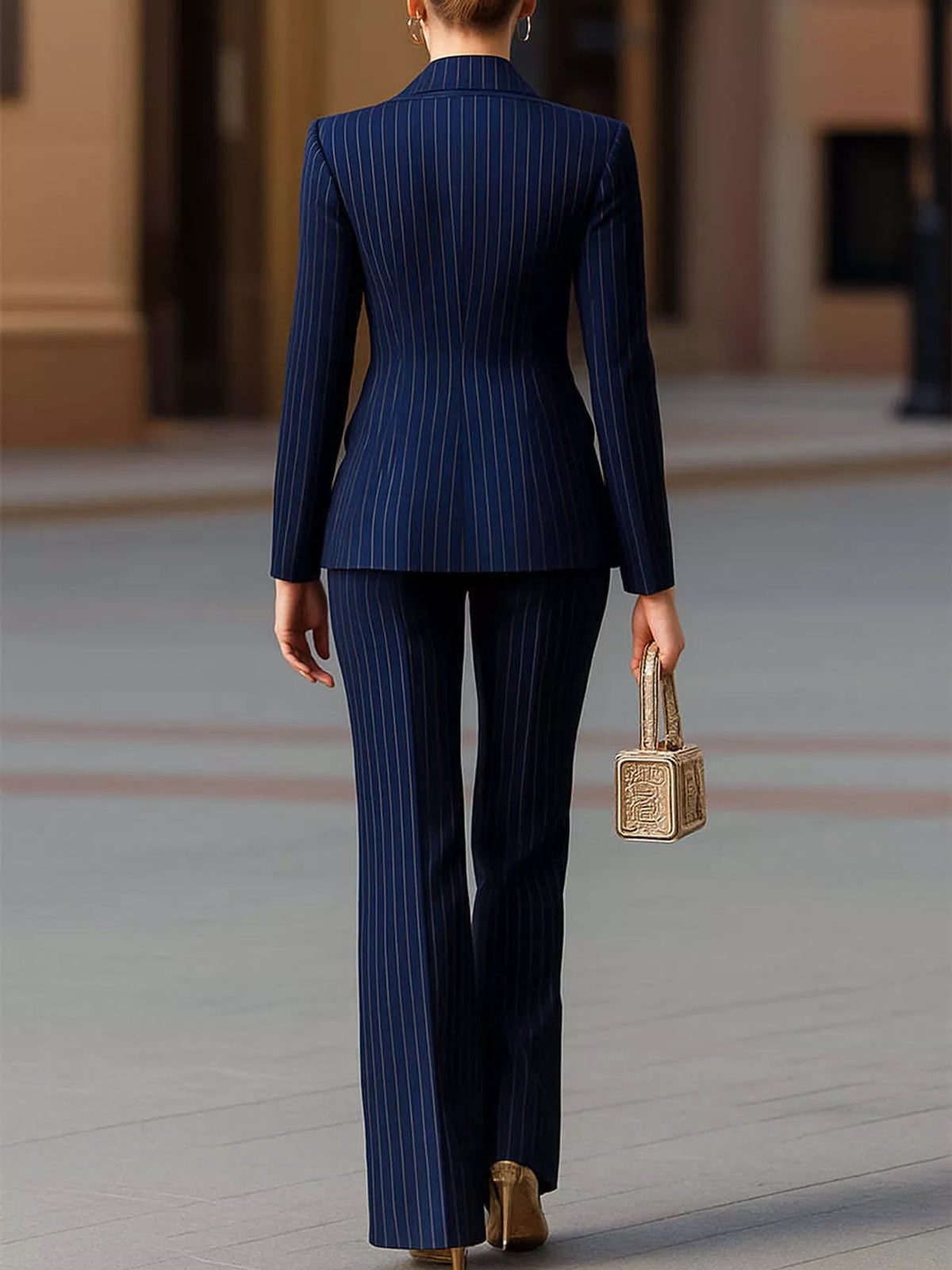 Navy pinstripe blazer and wide-leg pants set, back view with fitted blazer waist.