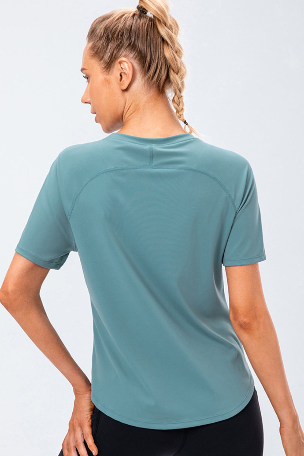 Teal active tee with round neck and raglan sleeves, back view