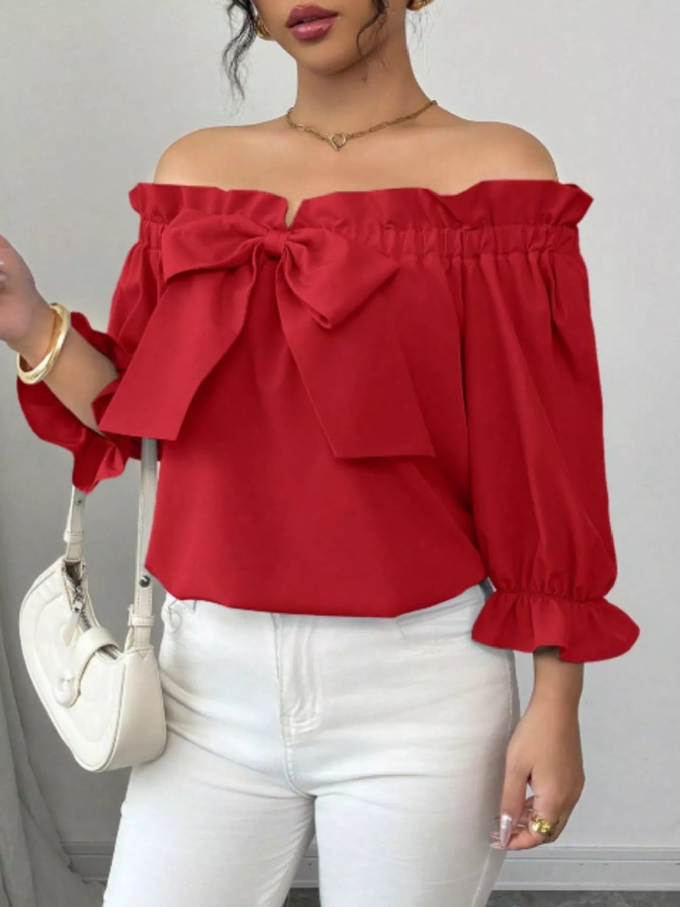 Bow Flounce Sleeve Blouse by Trendsi; red off-shoulder top with a large bow and ruffled neckline.