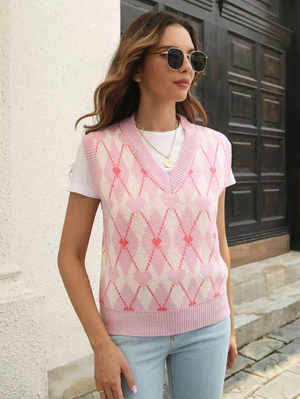 Blush pink geometric V-neck sweater vest with diamond argyle knit and sleeveless fit
