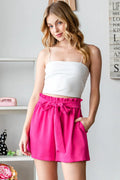 Fuchsia high-waist tied texture shorts with wide fabric bow at the front