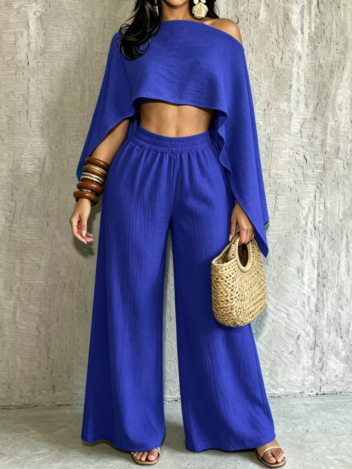 Women’s blue boat-neck crop top with wide-leg pants, draped sleeves and elastic waist