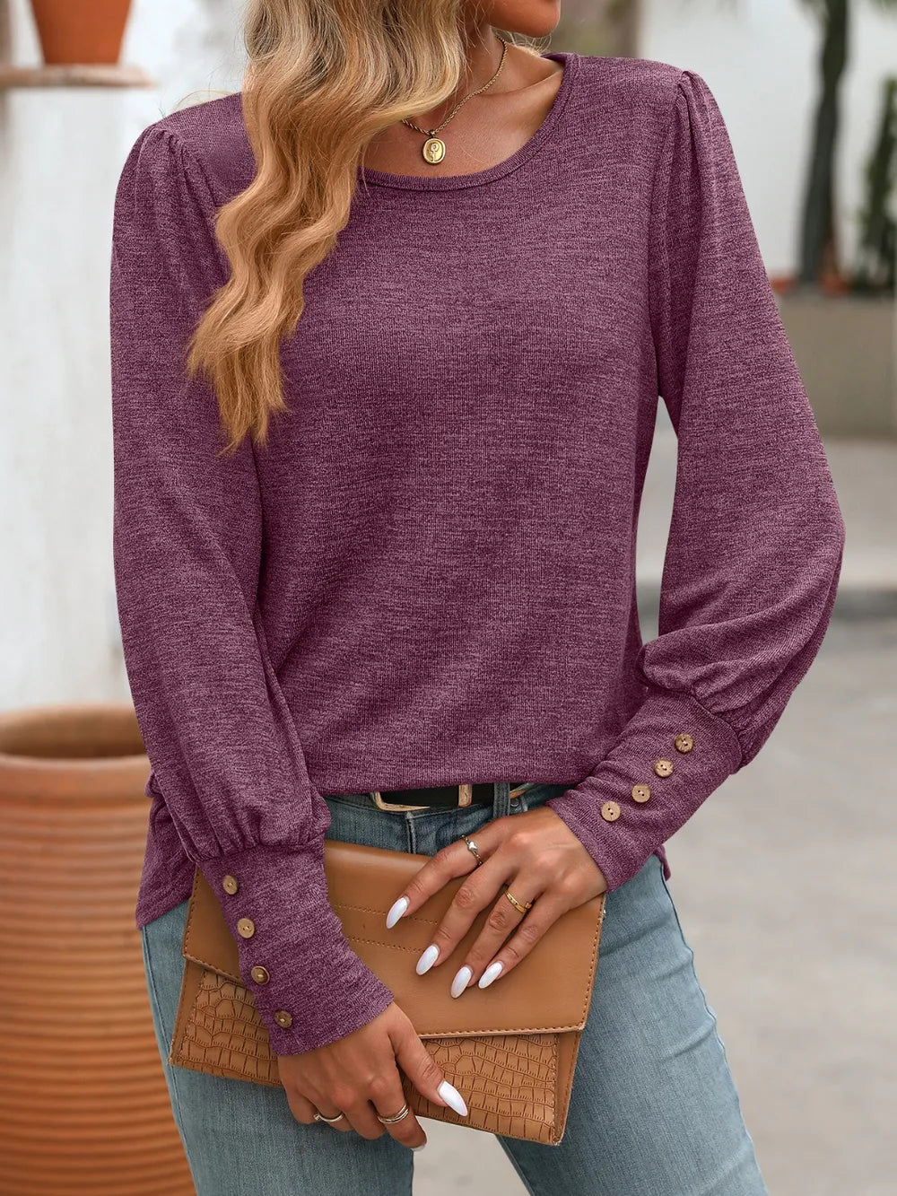 Purple long sleeve round-neck t-shirt with gathered, button-detailed cuffs