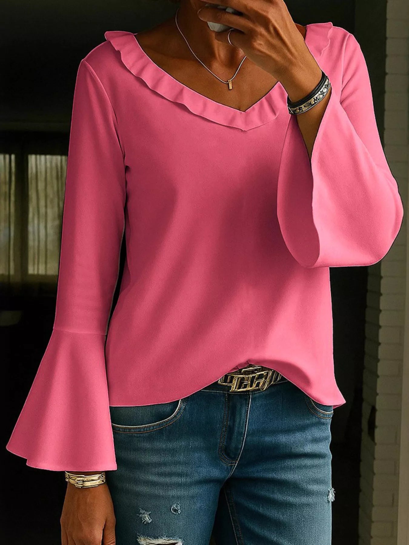 Fuchsia pink ruffle V-neck blouse with flared bell sleeves