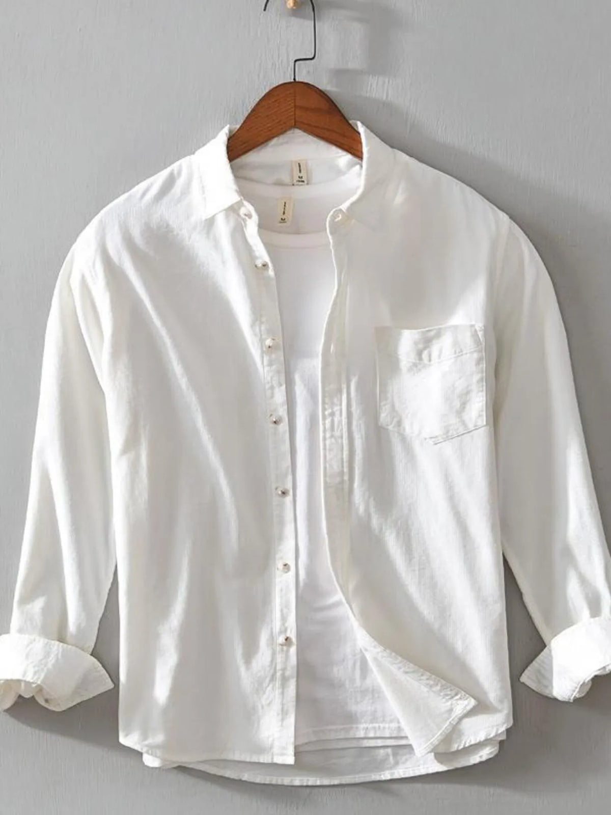 Men's white cotton button-up shirt with long sleeves, button front, and chest pocket