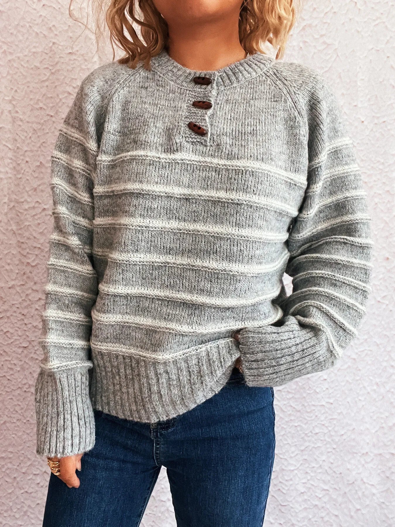 Light gray striped long sleeve sweater with button placket and ribbed knit cuffs