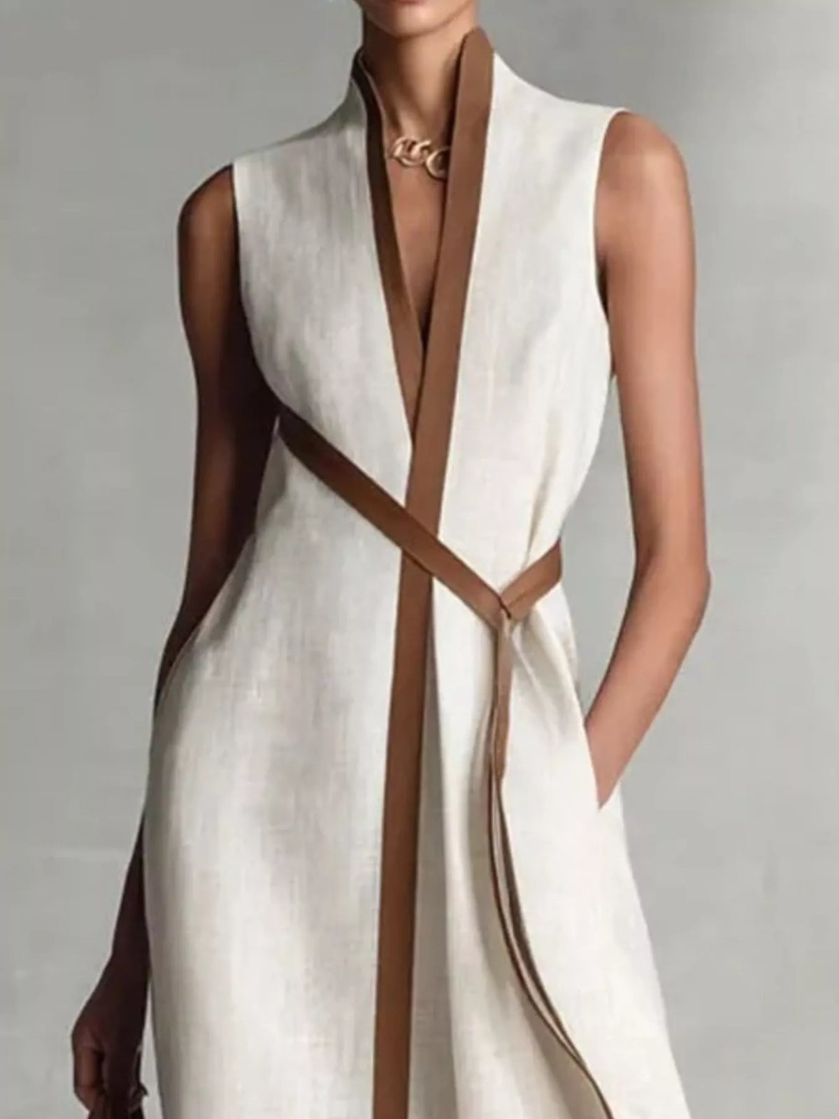 White wrap maxi dress with contrast trim, sleeveless V-neck and tie belt at waist
