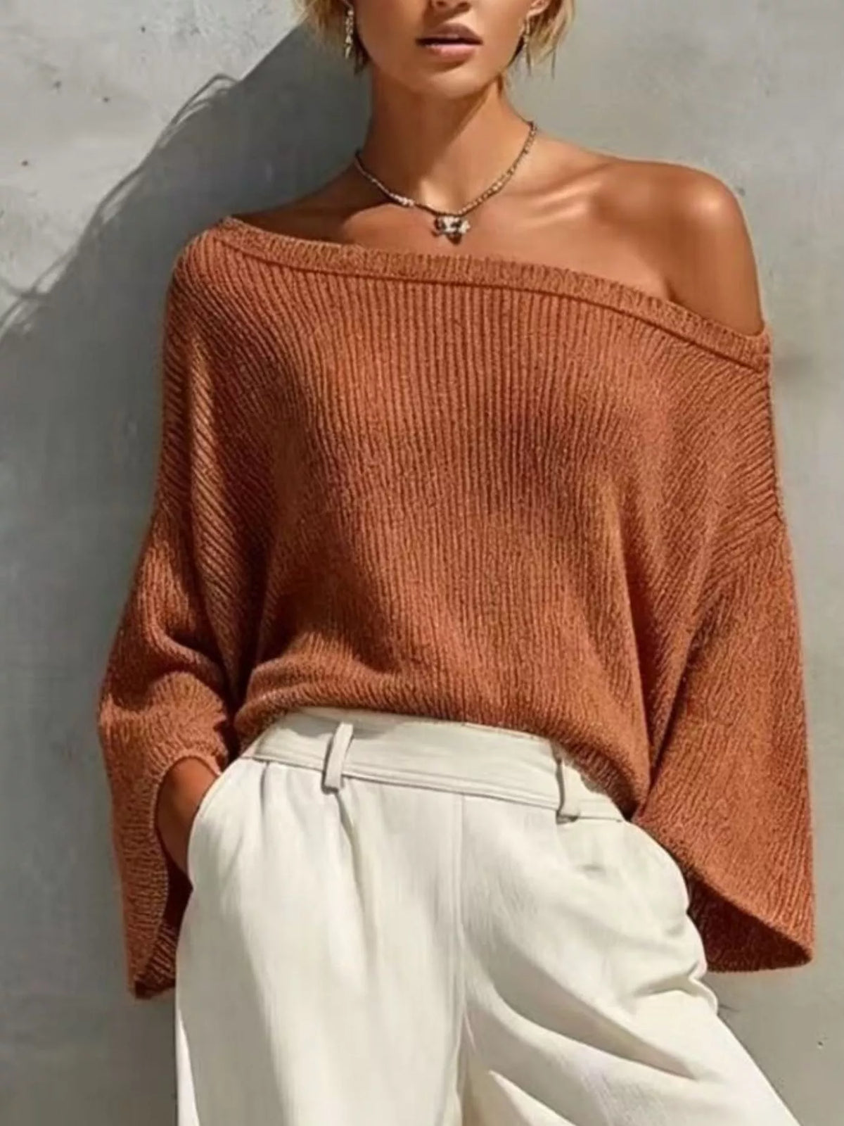 One-shoulder knit top and high-waisted pants set, rust top with white pants
