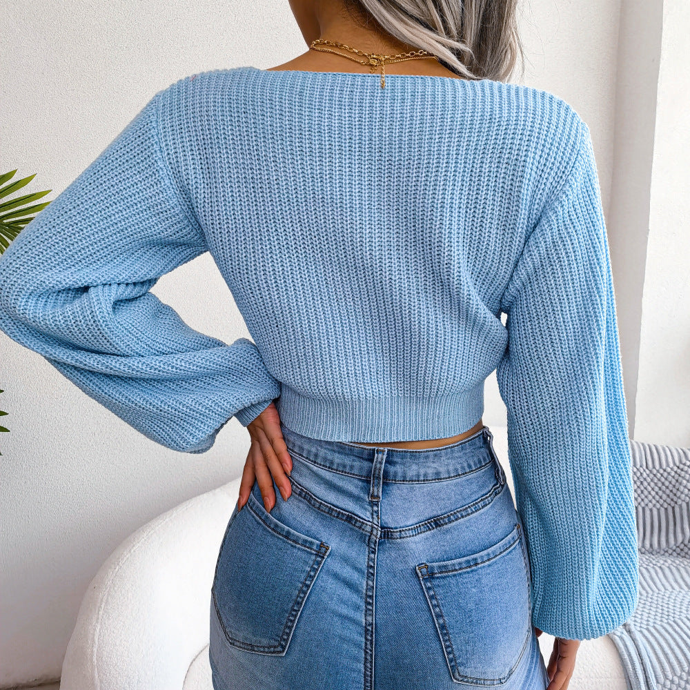 Sky blue tie-front rib-knit cropped sweater, long sleeves, back view