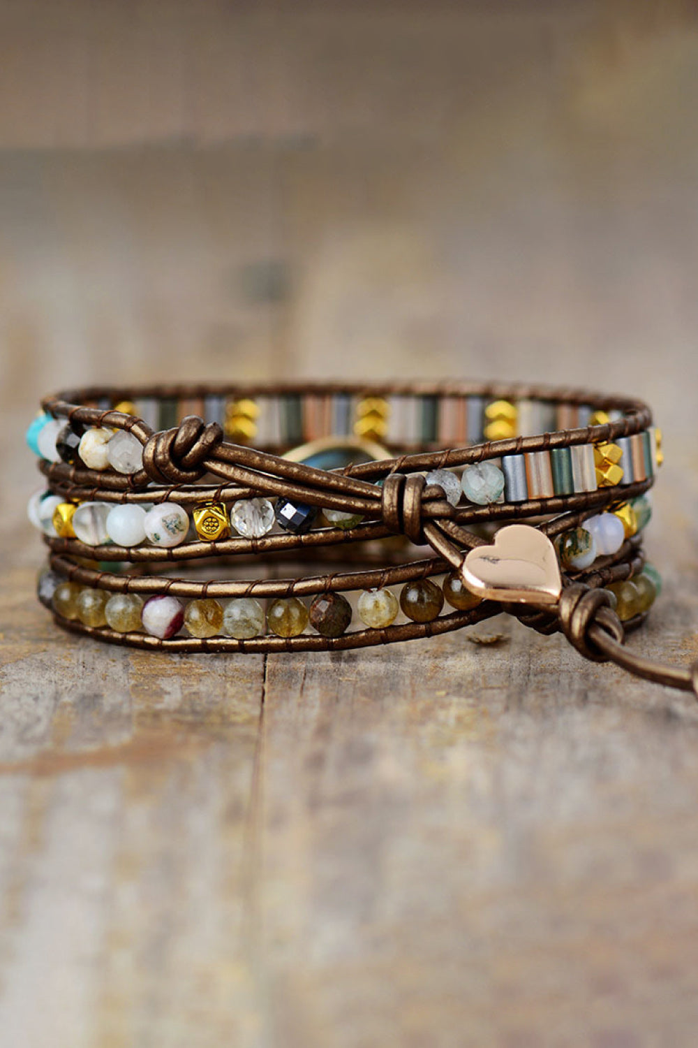 Triple-layer beaded bracelet with brown wrap and clasp detail, multicolor beads