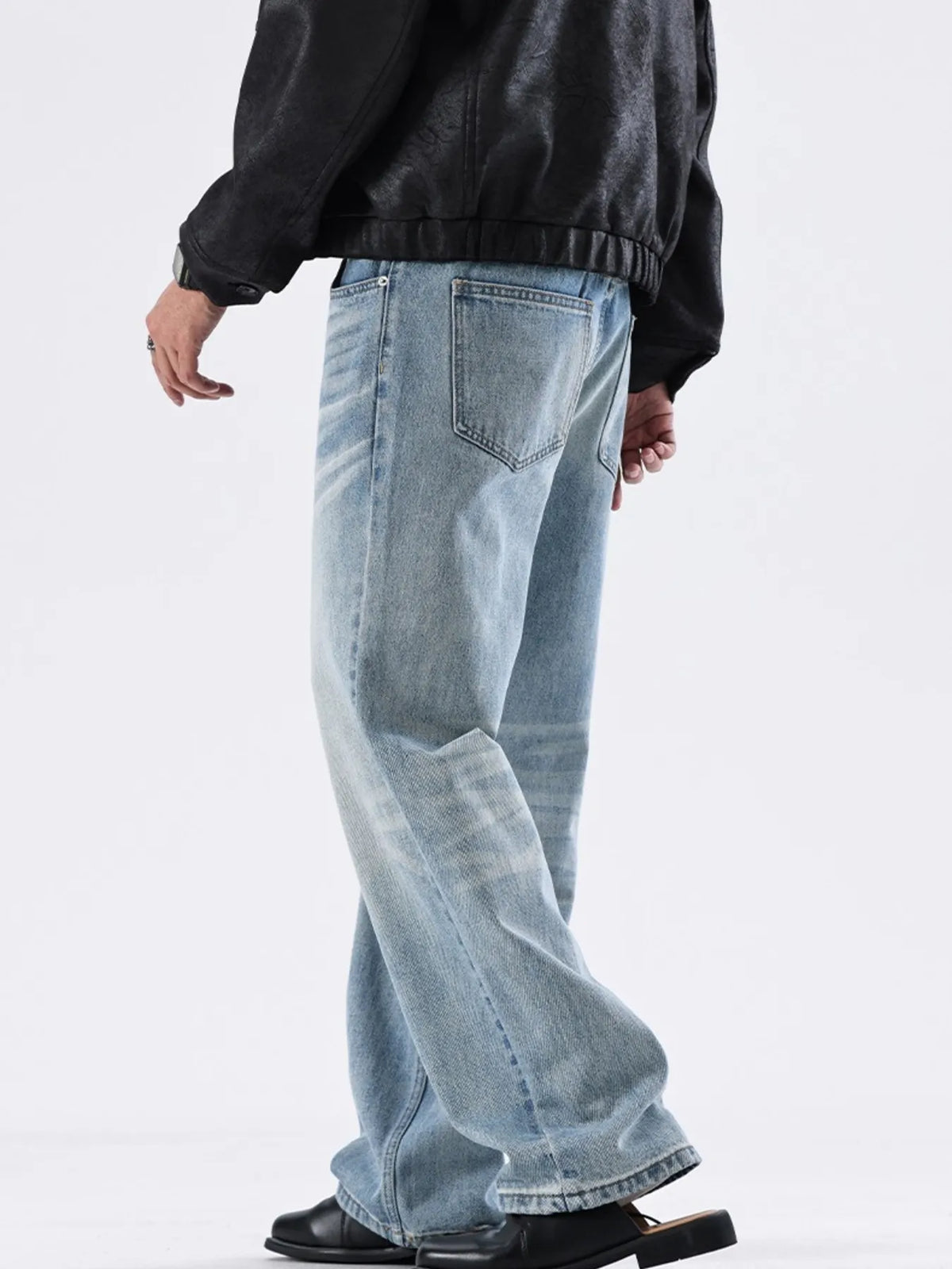 Washed sky-blue wide-leg jeans with front patch pockets and relaxed waistband