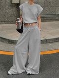 Light gray round-neck top with drawstring waist wide-leg pants set, standing view
