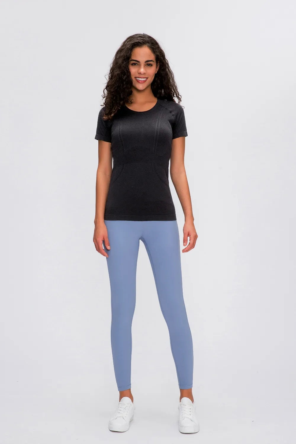 Black round-neck short-sleeve active t-shirt with smooth, fitted finish.