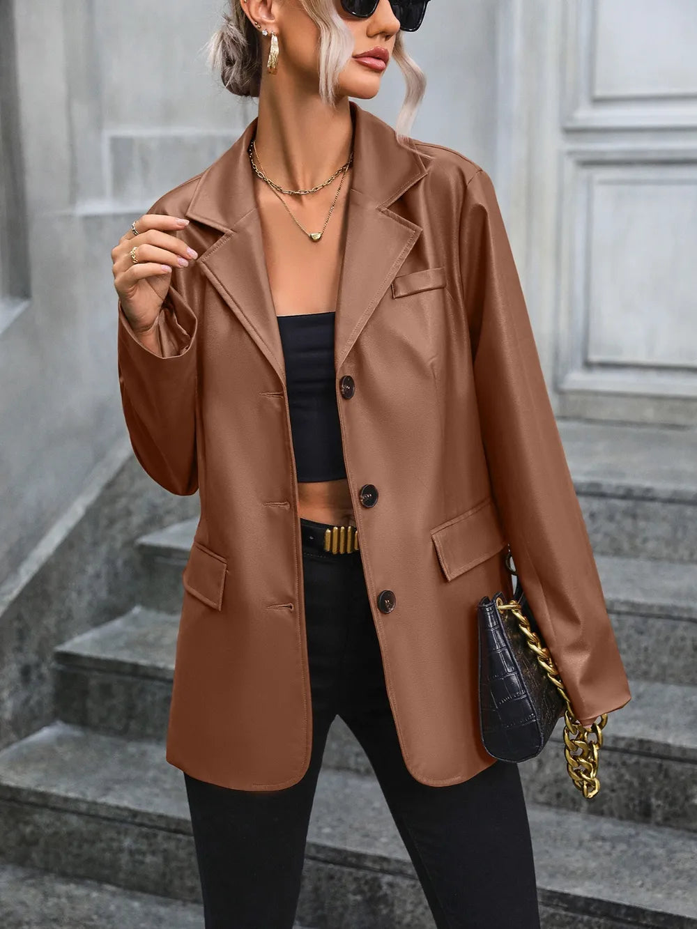 Brown button-up blazer with collared neckline, button front, and flap pockets