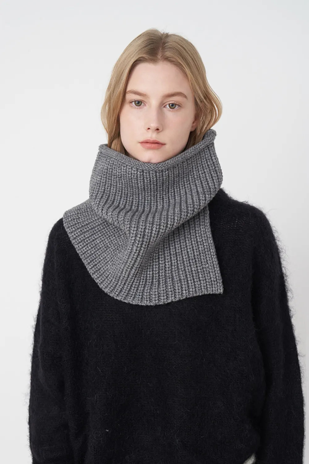 Dark gray ribbed knit scarf with folded cowl wrap around the neck