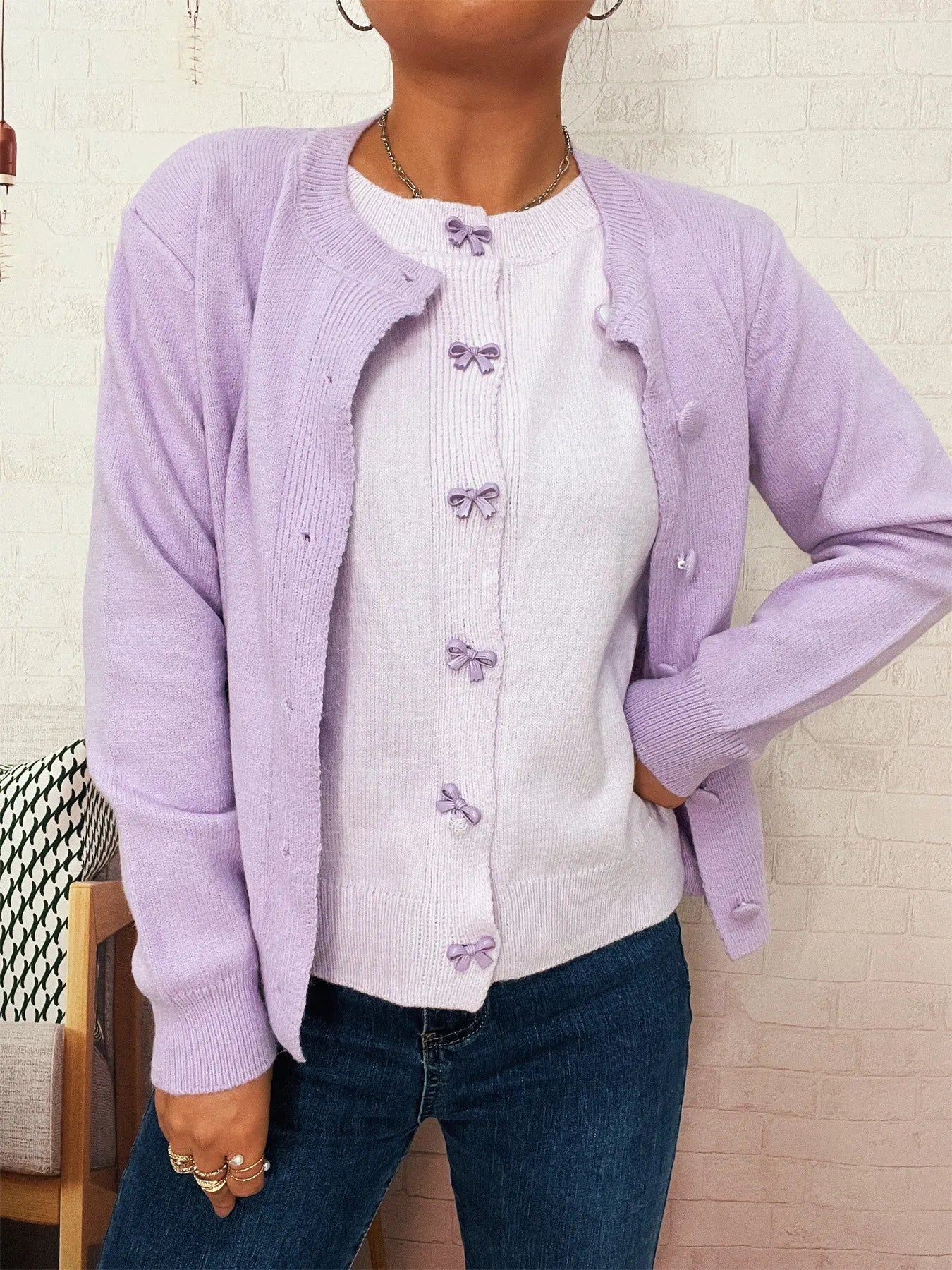 Lavender button-up long sleeve cardigan with front buttons and bow details
