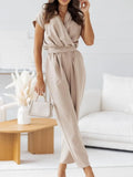 Beige surplice V-neck cap sleeve tie-waist jumpsuit with tapered ankle legs