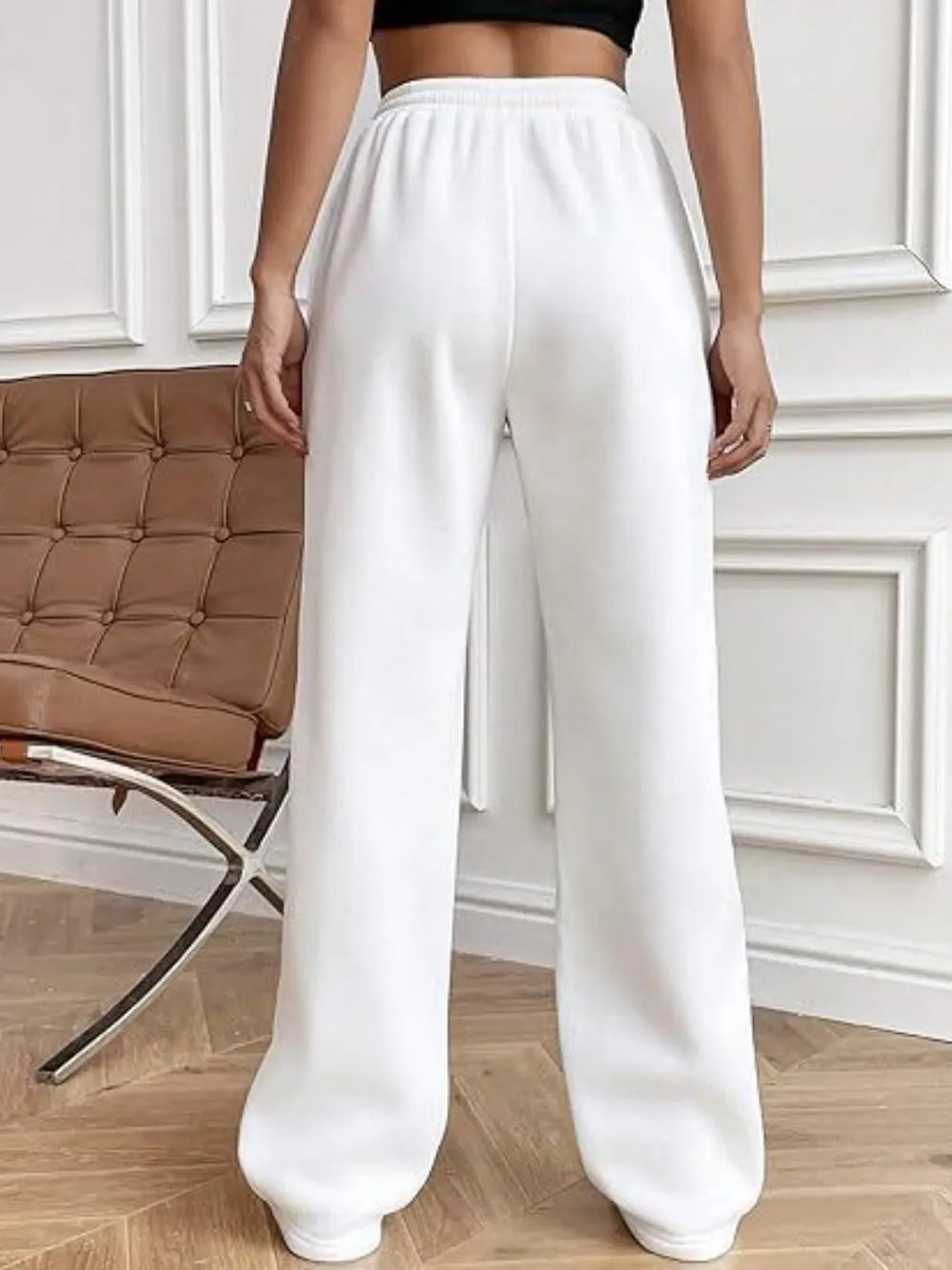 White wide-leg drawstring pants with pockets, relaxed straight legs