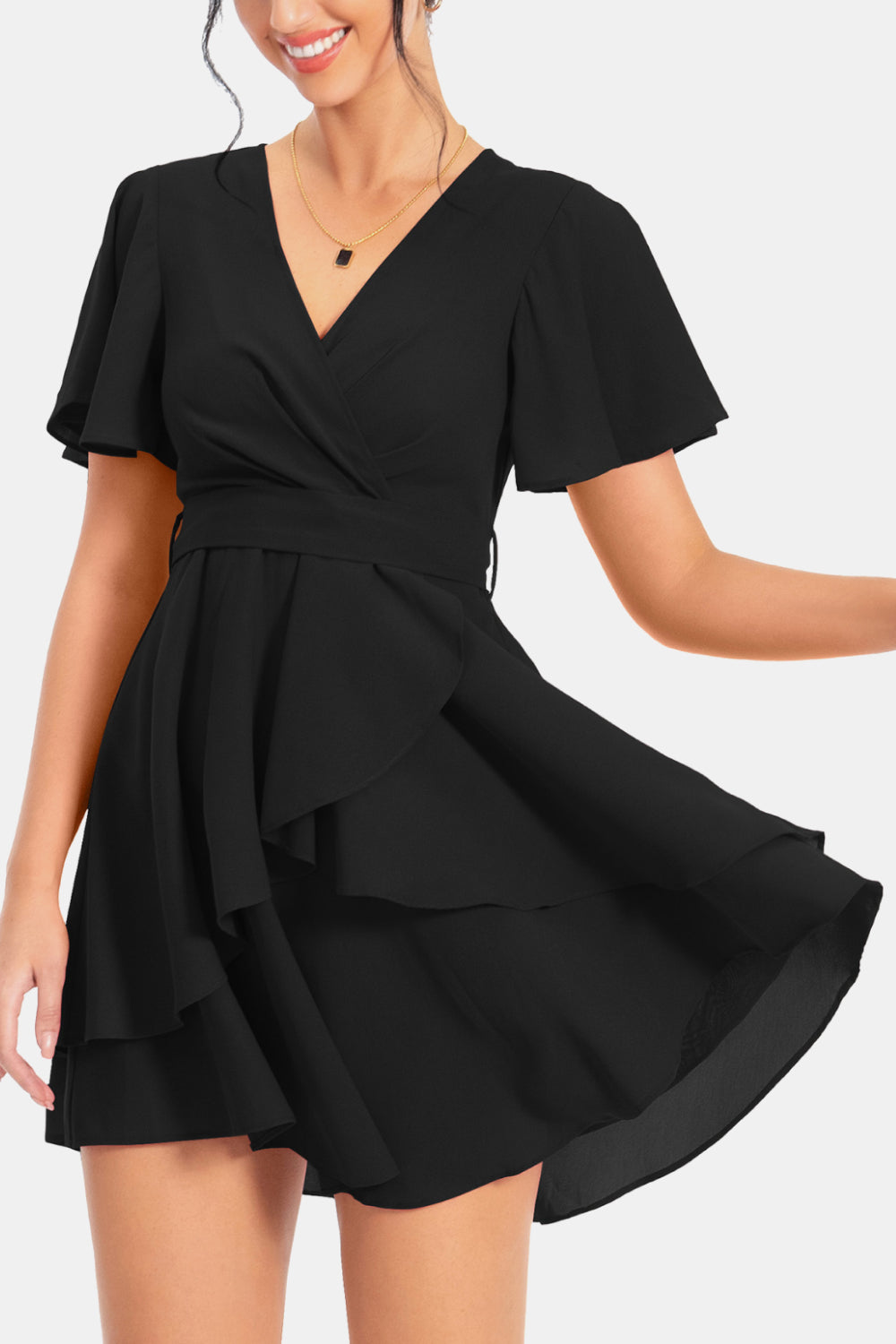 Black surplice V-neck flutter sleeve dress with flowing tiered skirt