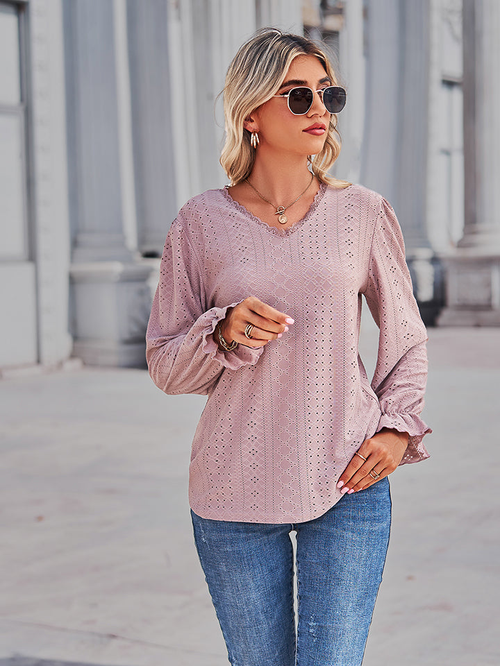 Blush pink eyelet V-neck blouse with flounce sleeve cuffs and fitted waist shaping