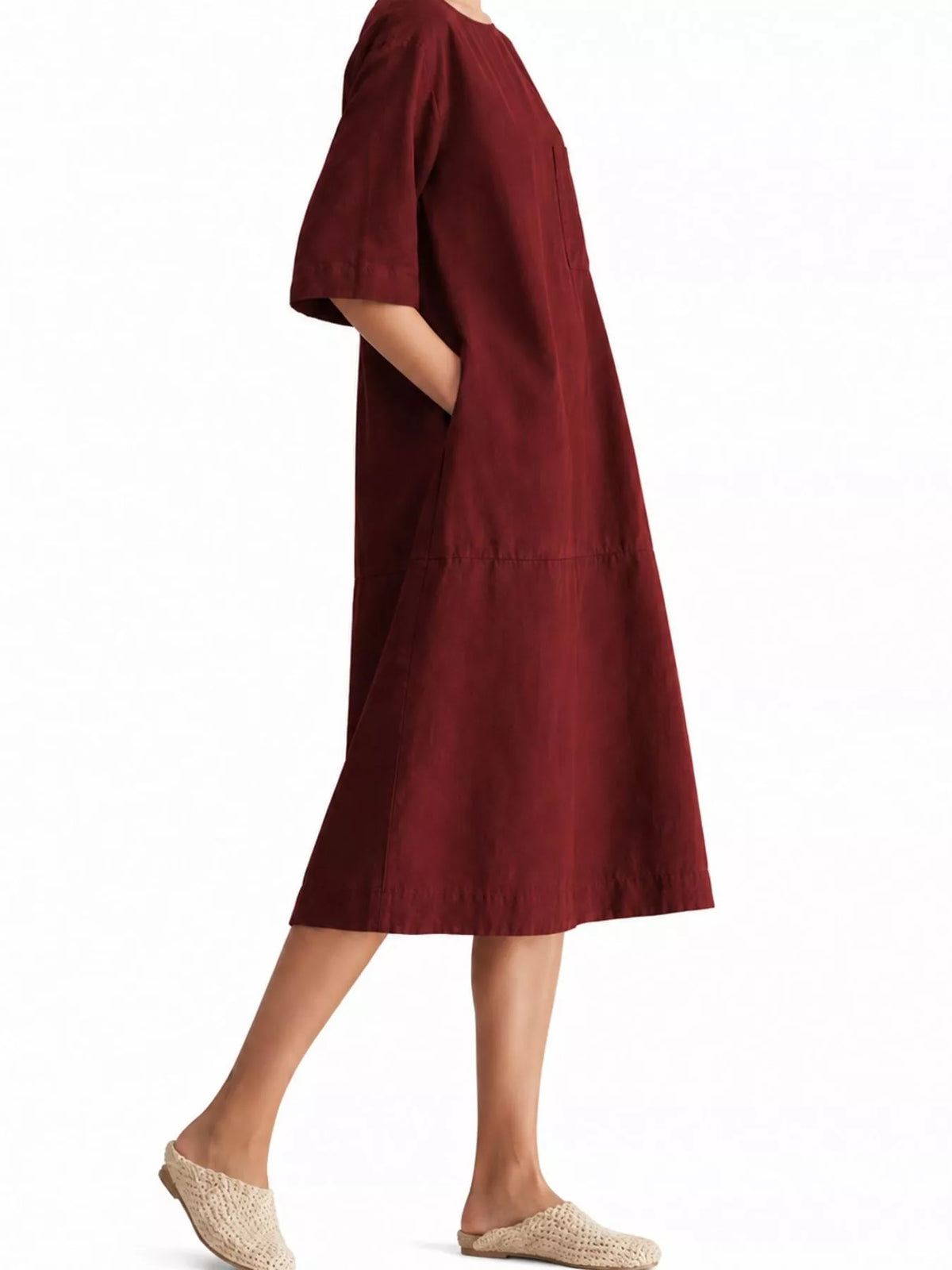Burgundy linen-blend midi dress in side view, showing its loose shape and short sleeves