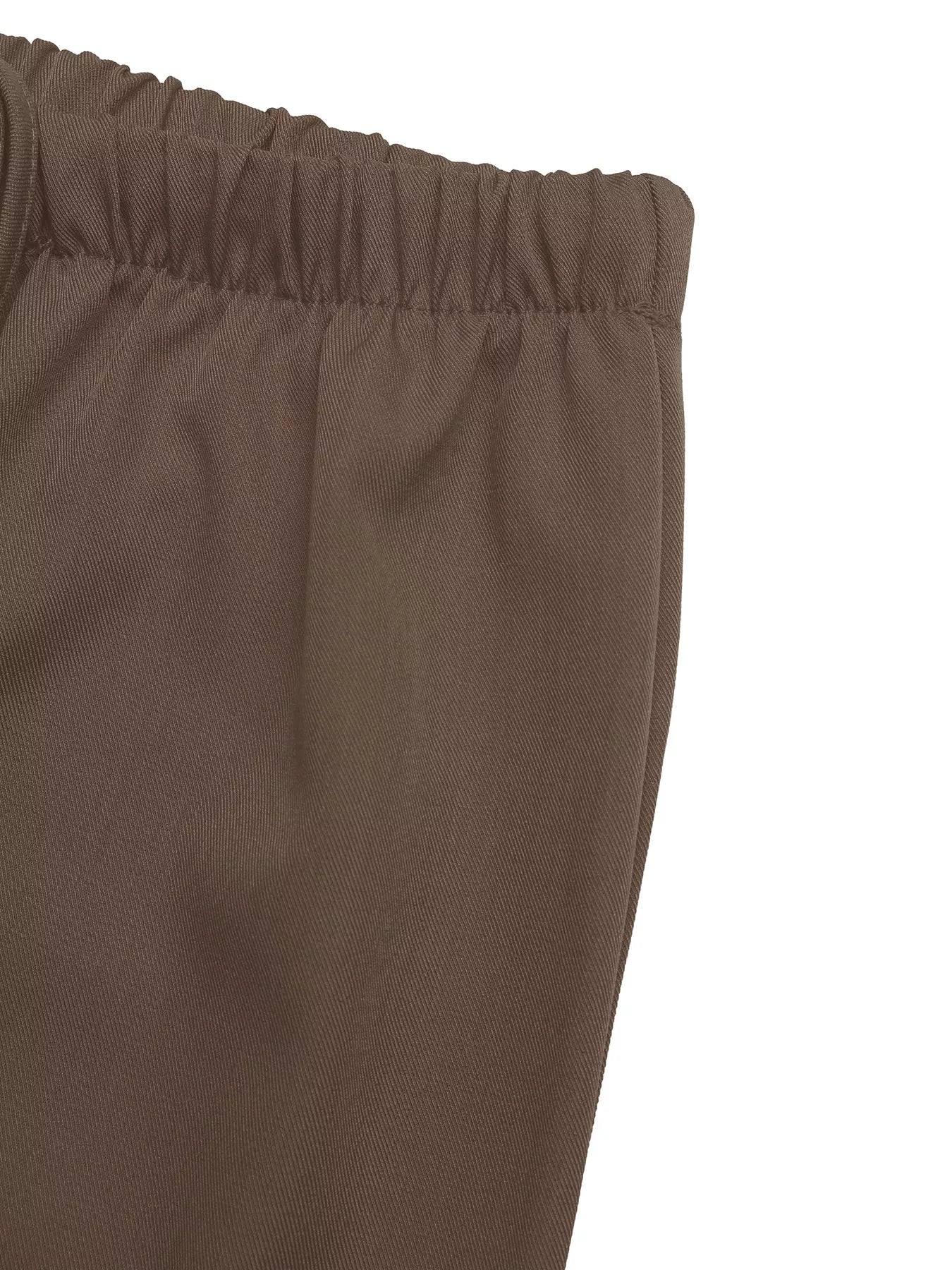 Brown elastic waistband on wide-leg drawstring pants.