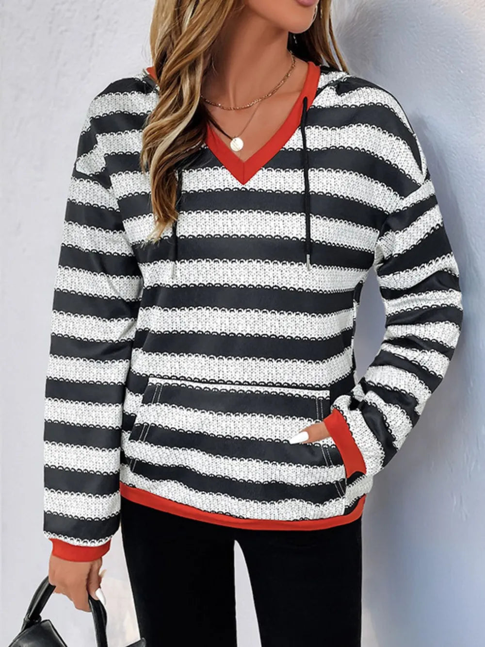 Contrast striped long sleeve hoodie with red-edged neckline and black-and-white stripes