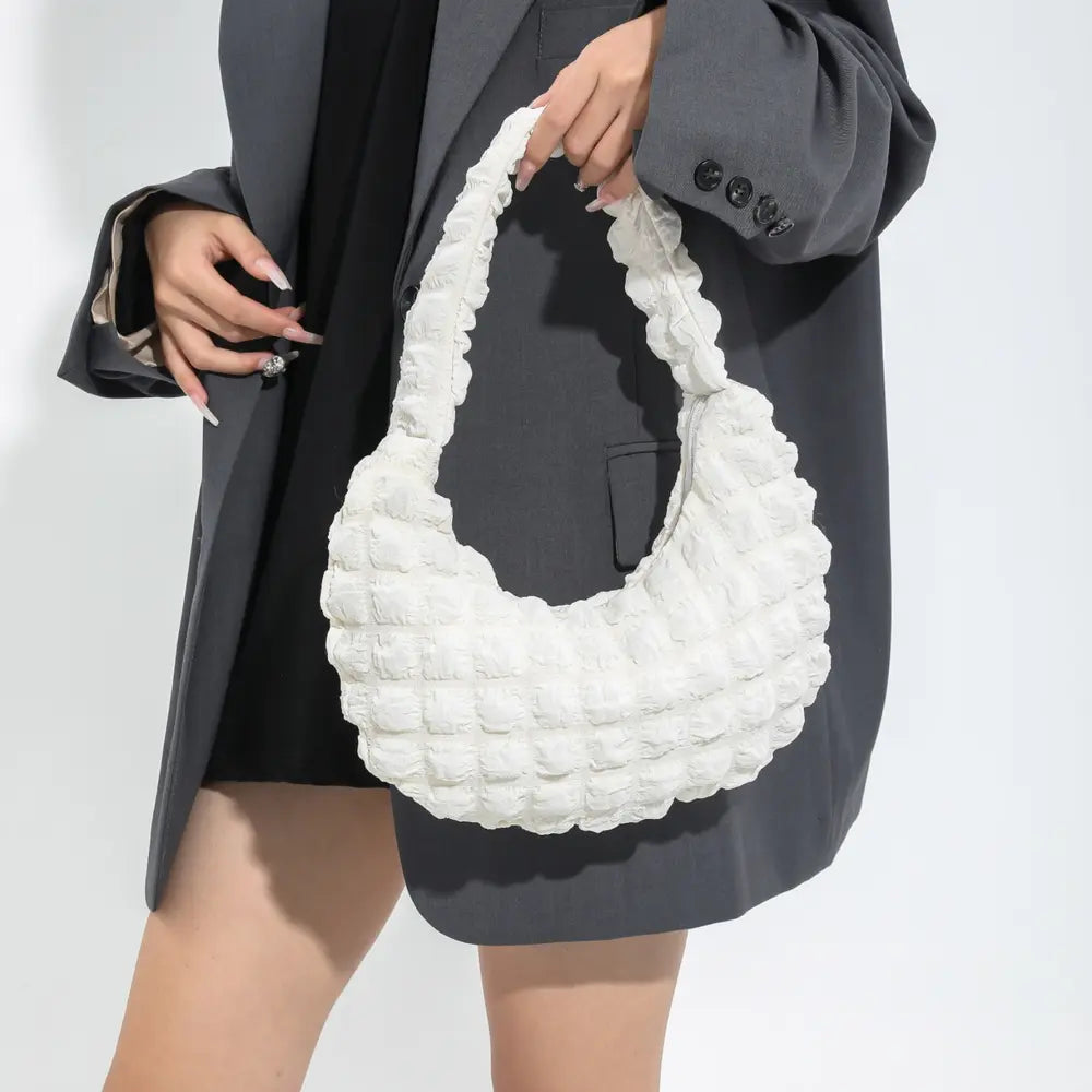 White textured small hobo handbag worn over the shoulder