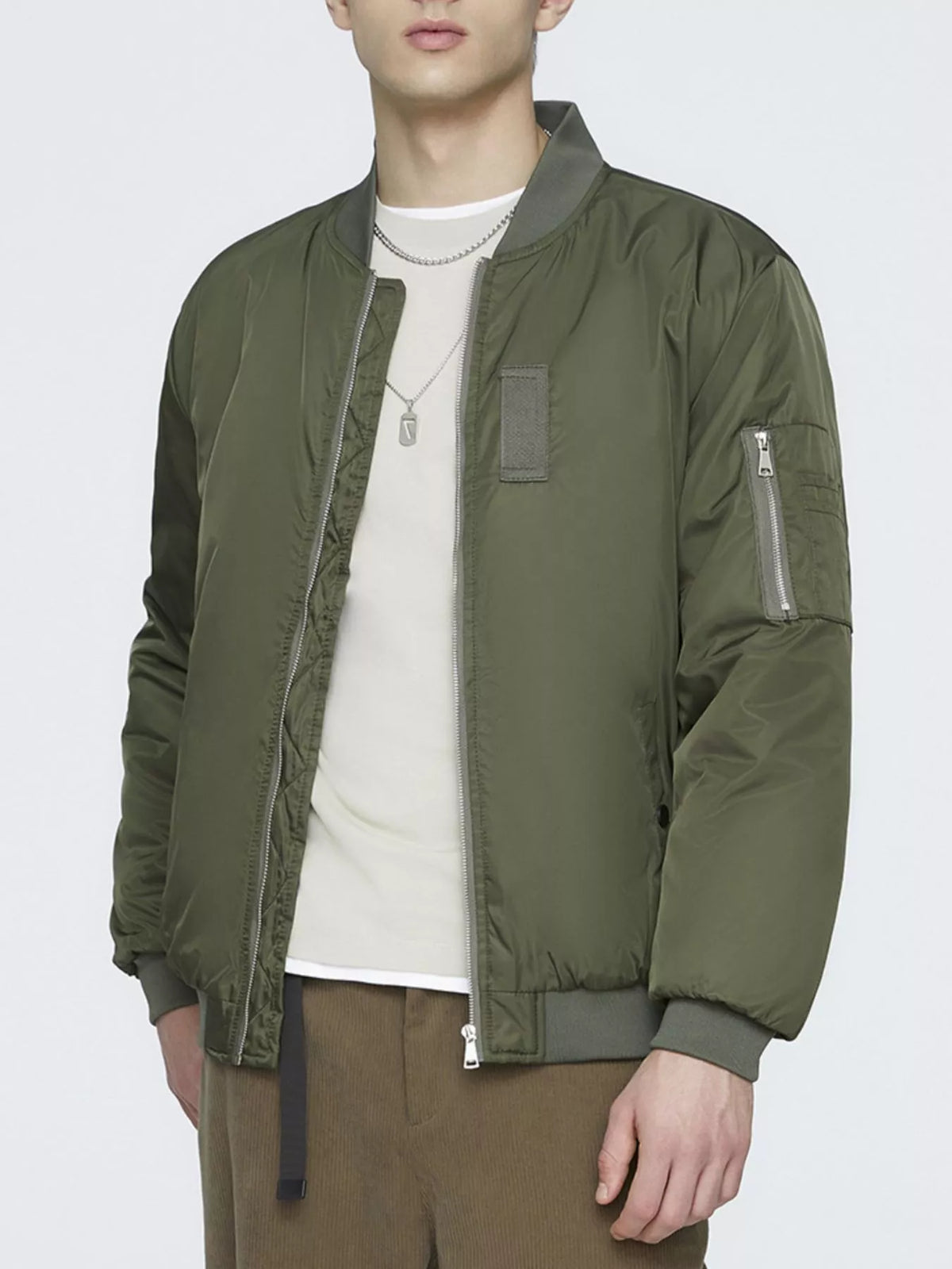 Lightweight military green bomber jacket with zip-front, chest pocket and ribbed cuffs