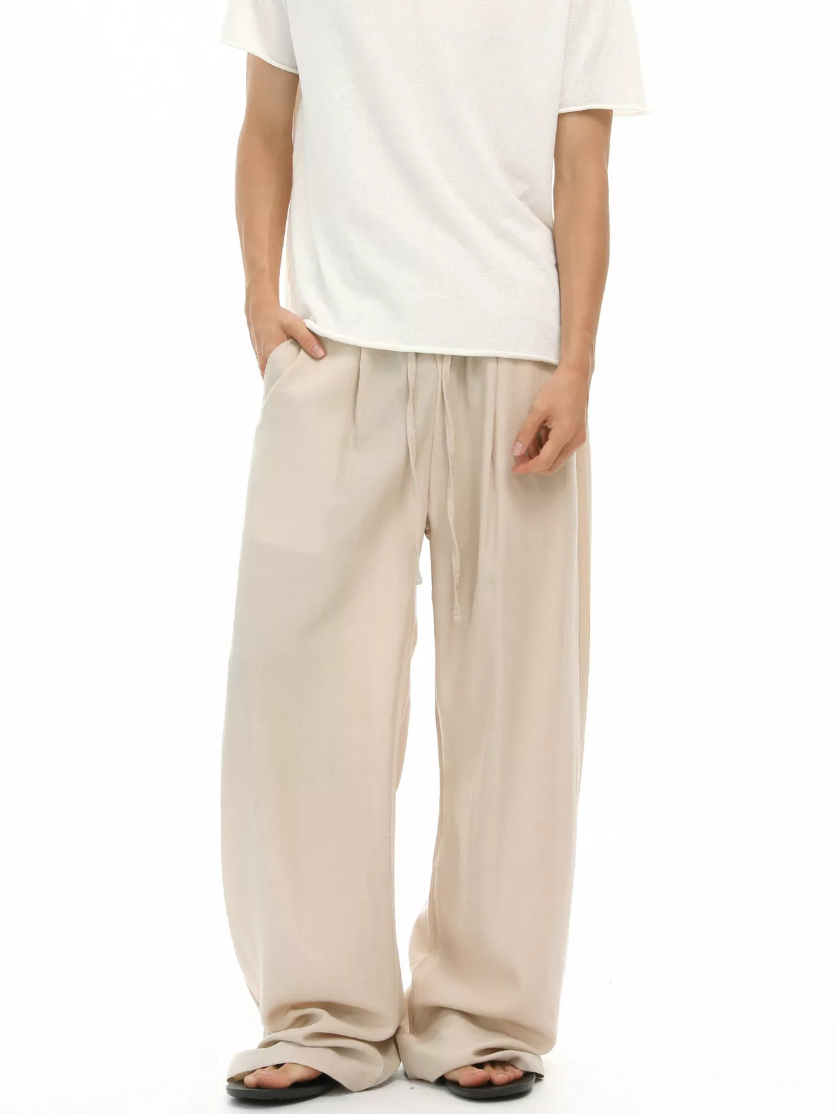 Khaki relaxed wide-leg drawstring trousers with pleated front