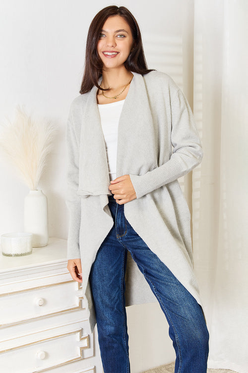 Light gray open-front duster cardigan with pockets, relaxed fit over jeans