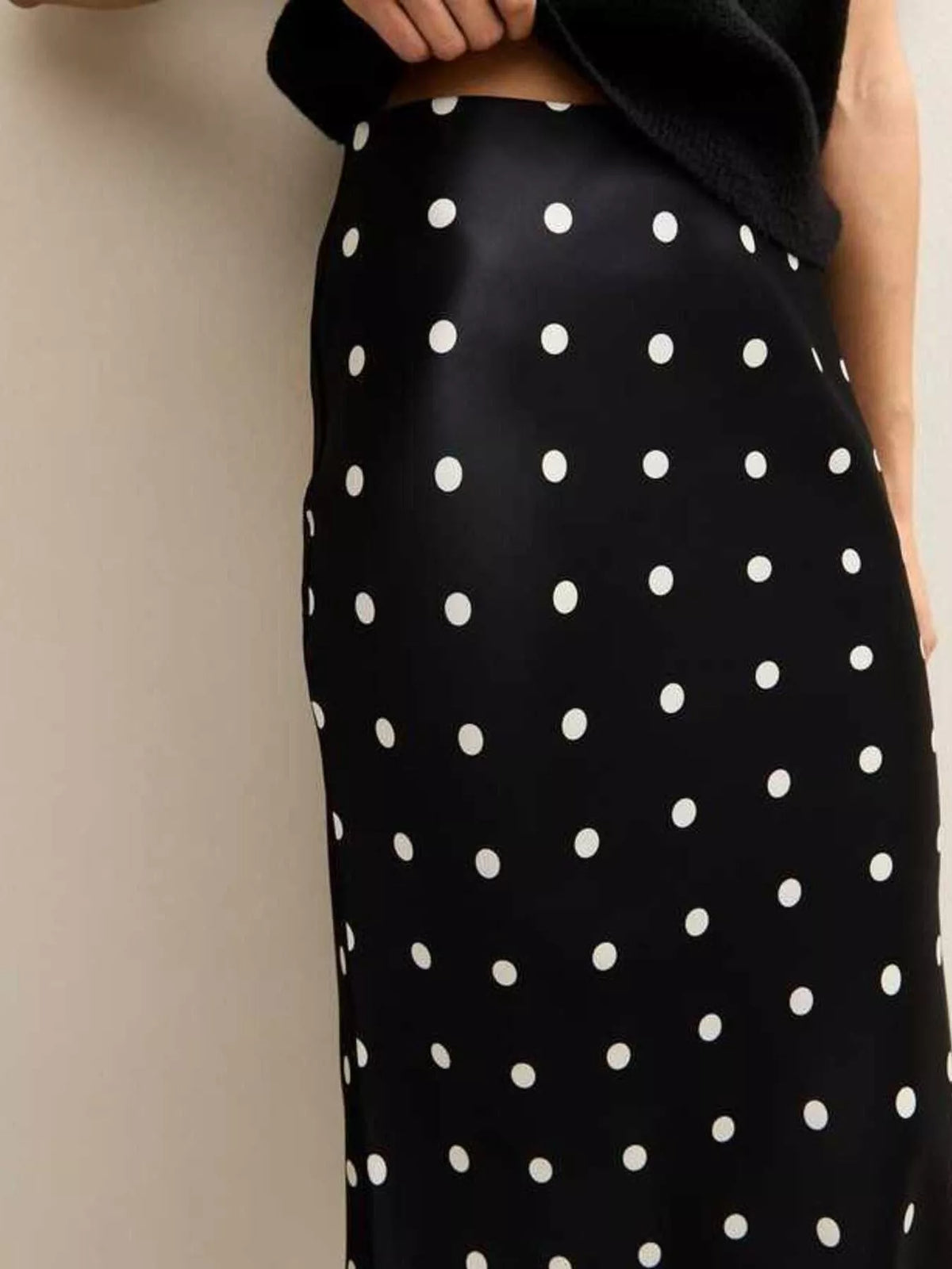 Black midi skirt with large white polka dots and lace-trim hem