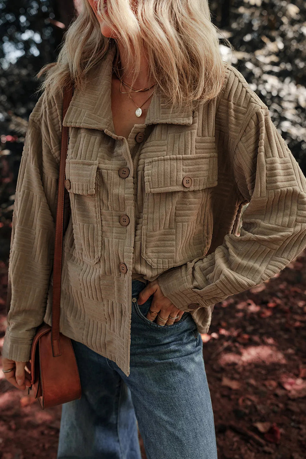 Taupe textured collared shacket with button front, flap pockets, and long sleeves