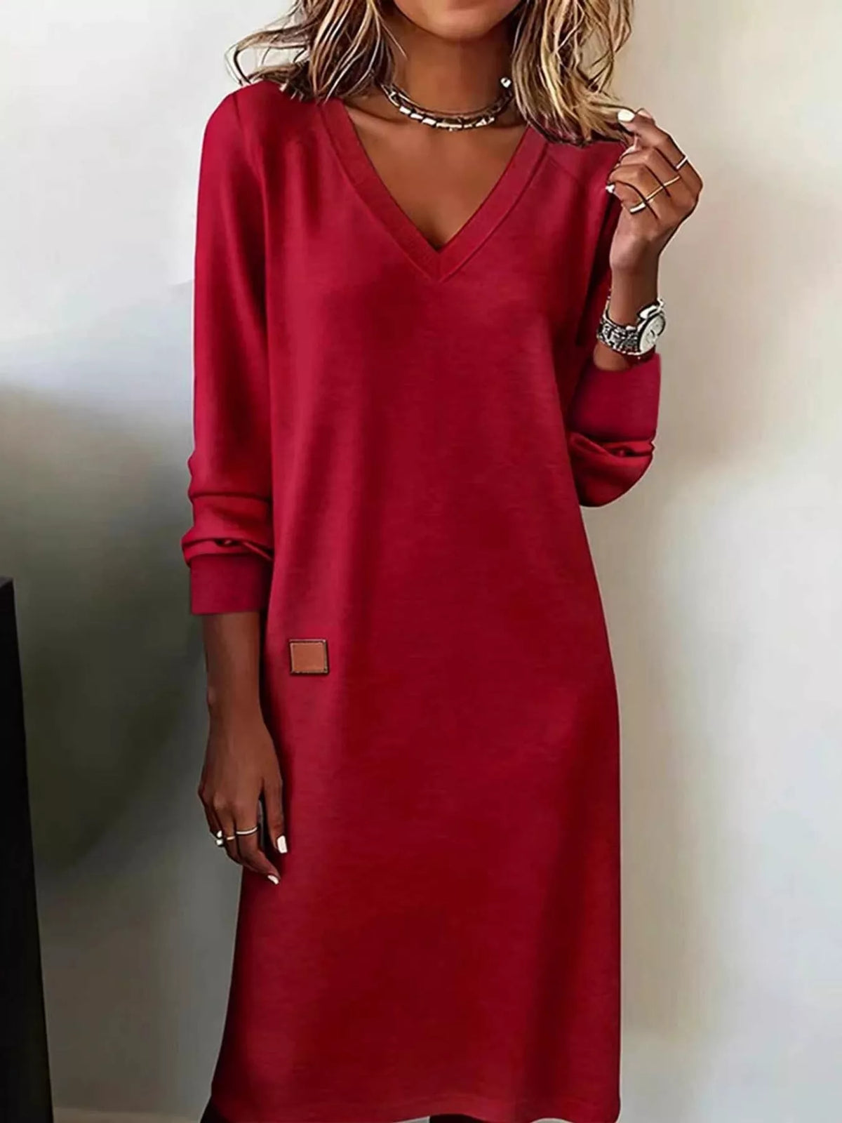 Red V-neck long-sleeve midi dress with small square chest patch and cuffed sleeves