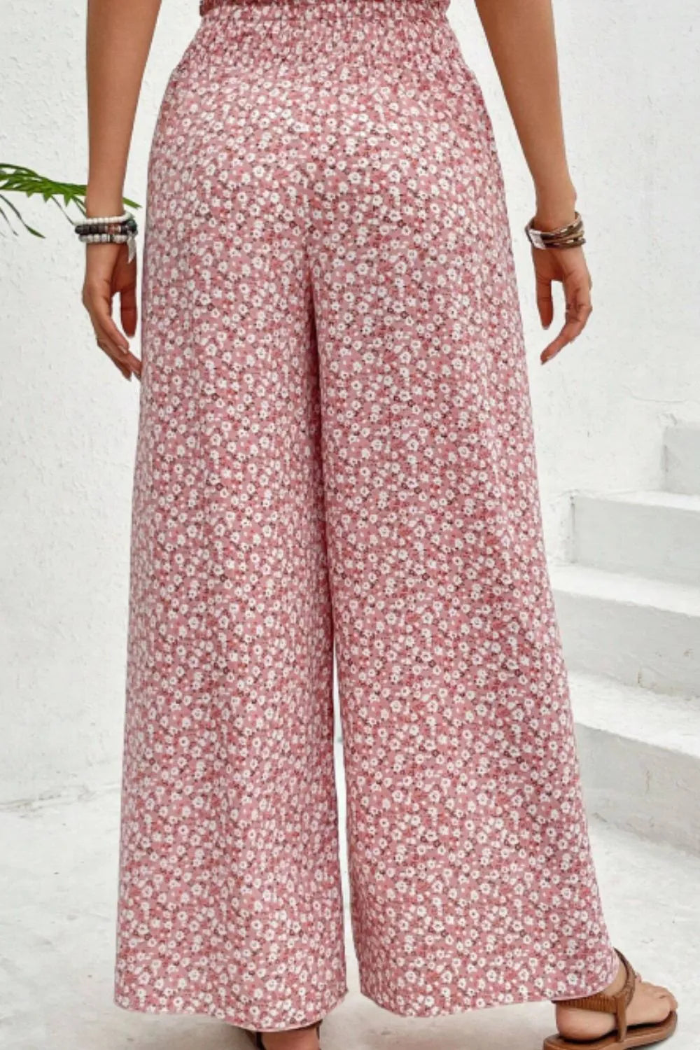 Blush pink floral printed wide-leg pants with gathered elastic waist and wide legs