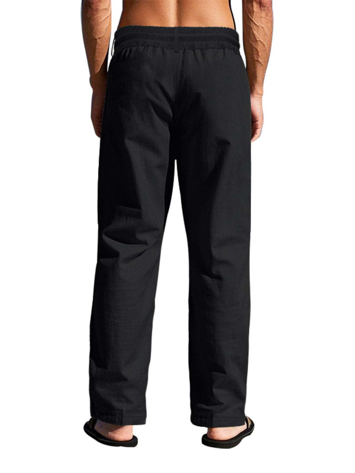 Lightweight men’s black drawstring pants from back view with elastic waistband