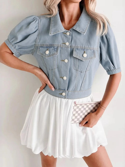 Light blue cropped denim jacket, puff sleeves, button placket, flap pockets at front