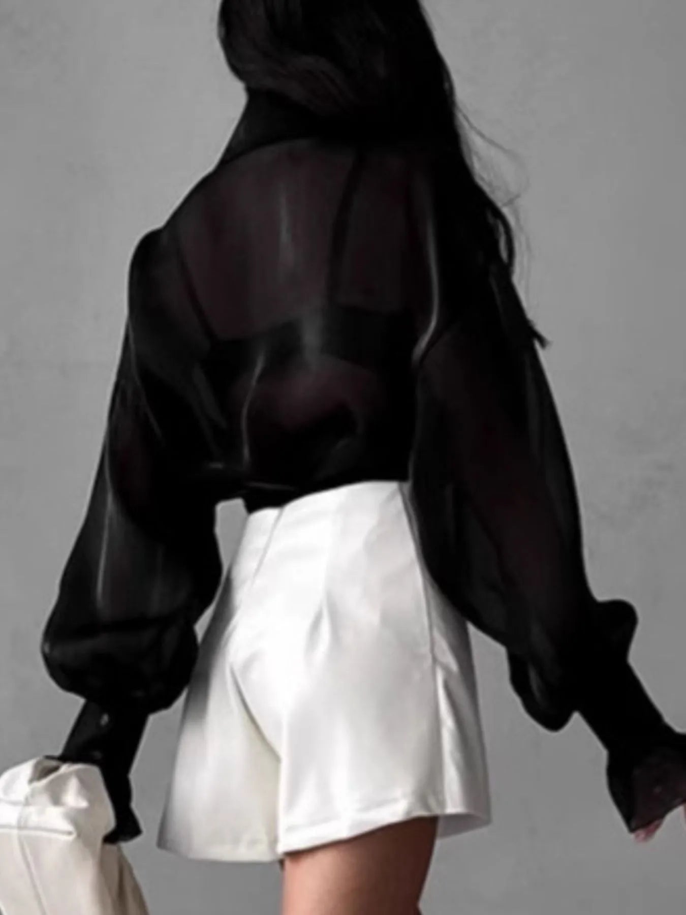Black button-up shirt with sheer fabric, puff flounce sleeves, and pointed collar