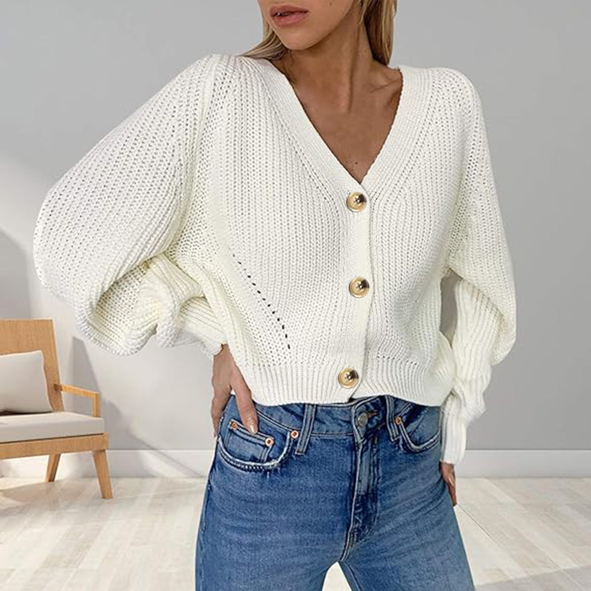 Off-white V-neck button-front long sleeve cardigan with gold button placket
