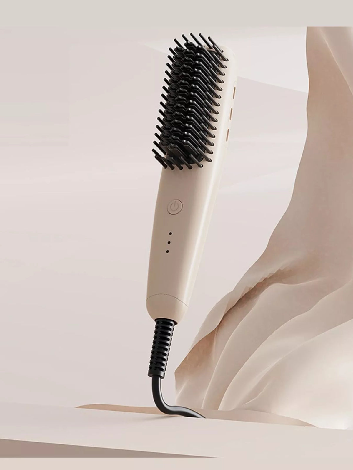 Ivory heated straightening comb with black bristles and cord at bottom.