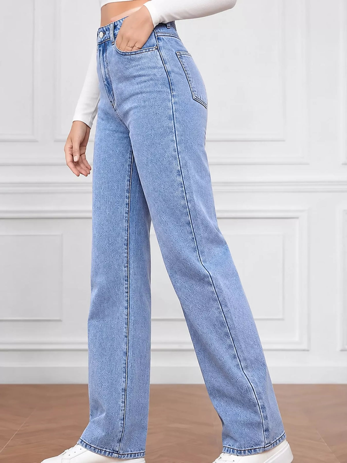 High-waisted vintage wash denim jeans with button waistband and wide straight leg