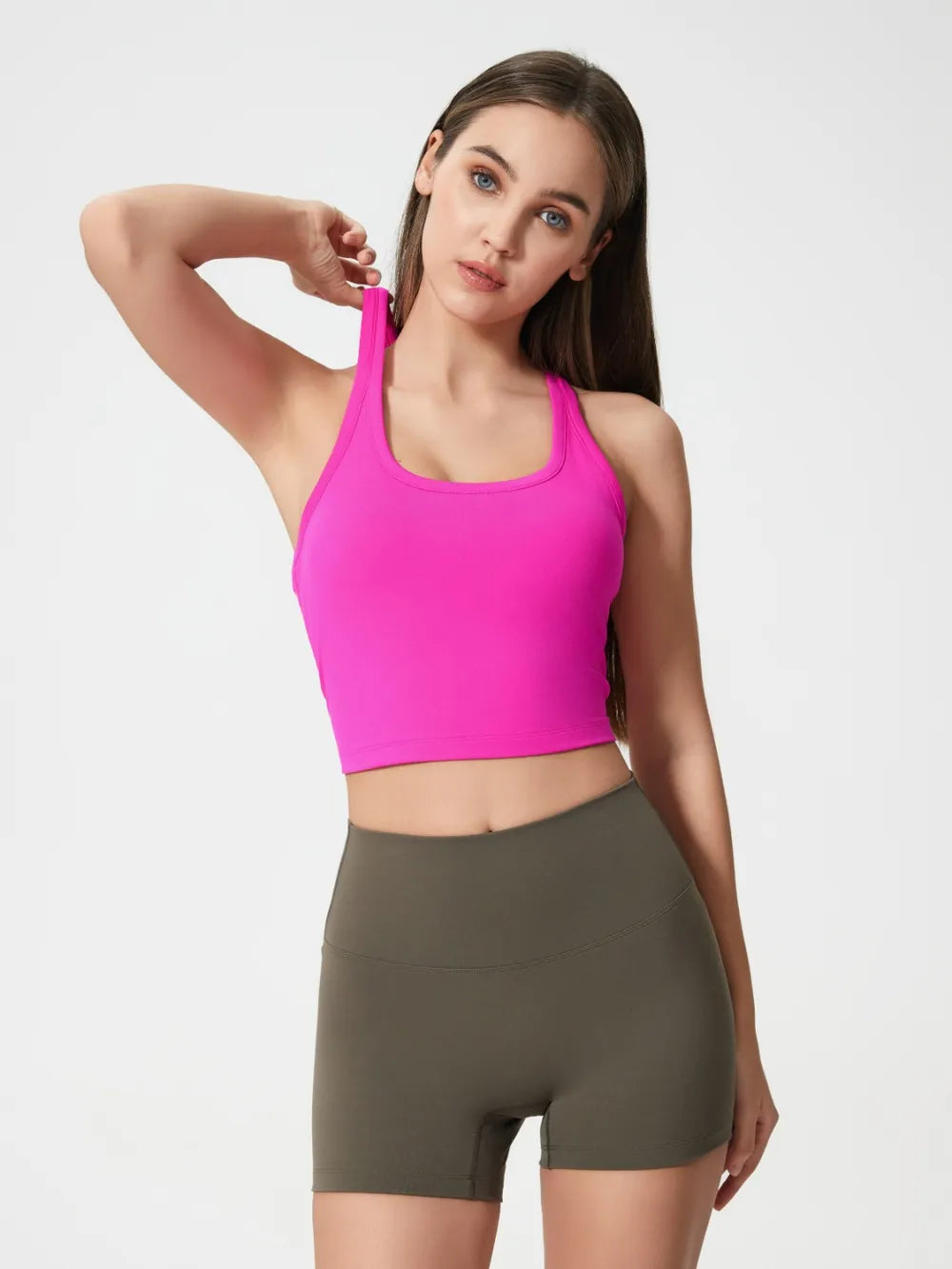 Hot pink scoop neck active tank with racerback and fitted stretch silhouette.