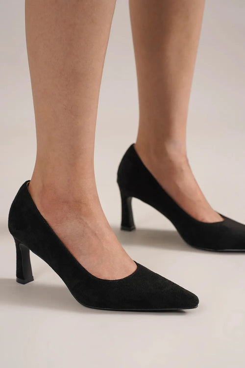 Black faux suede point-toe pumps with stiletto heel, front three-quarter view